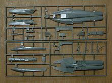 All the parts are molded together using what is called a "Cold Runner."